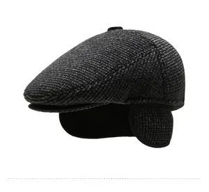 Detail view of winter flat cap with thick wool texture and fold-out ear protection