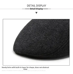 Detailed macro shot of the durable brim on a winter wool newsboy cap for elderly men