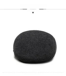 Front view of grey plaid ivy cap for men, featuring textured wool blend fabric detail