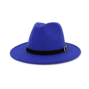 Detailed texture of royal blue wool fedora with black decorative band and silver buckle