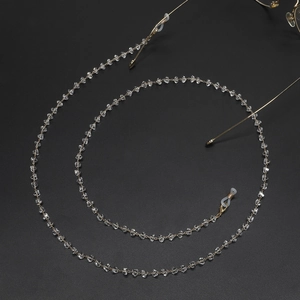 Golden sunglasses chain with crystal beads and anti-slip hooks on black background