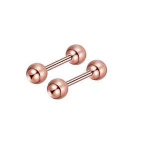 Macro shot of two rose gold stainless steel ball stud earrings with smooth metallic finish
