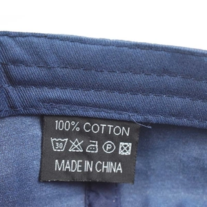 Detailed view of the 100% cotton wash label and inner stitching on the baseball cap