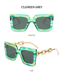 Détails de lunettes de soleil carrées avec monture gris-vert et branches dorées
