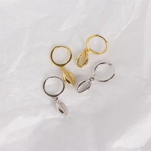 Detailed view of S925 sterling silver shell drop earrings in gold and silver finishes