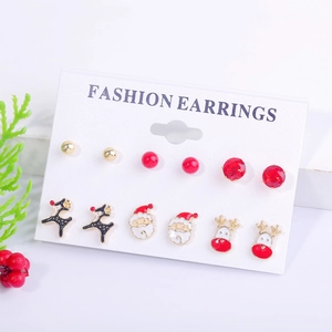 Close-up of 6-pair Christmas stud earring set featuring reindeer and Santa on a white card