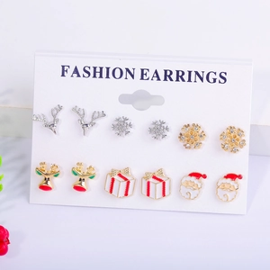 Close-up of a 6-pair Christmas earring set featuring snowflake and reindeer designs