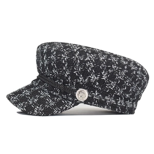 Classic black and white tweed baker boy hat with silver anchor button and rope detail
