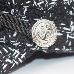 Black and white tweed octagonal military cap with braided rope and silver anchor button