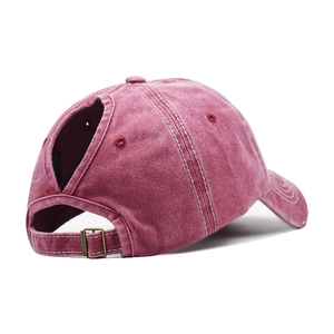 Detail of washed cotton baseball cap with ponytail hole and adjustable metal buckle
