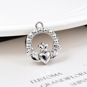 Detailed view of silver Claddagh heart charm pendant with crown for jewelry making