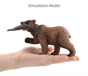 Detailed brown bear figurine with realistic fur texture holding a fish in its mouth