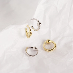 Detailed close-up of S925 sterling silver hoop earrings with metal beads in gold and silver