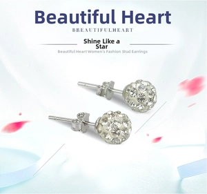 Detailed macro shot of 925 sterling silver ball stud earrings with shimmering crystals