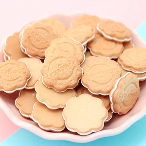 Close-up of DIY resin flower cookies with Congrats text for craft decoration