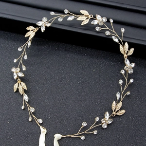 Elegant gold bridal leaf hair band with sparkling crystals and white ribbon ties