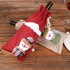 Christmas wine bottle covers with snowman figurines on red and beige burlap material