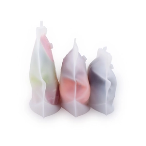 Three standing reusable silicone food storage bags with 250ml capacity mark on white background