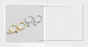 Detail view of S925 sterling silver hoop earrings with clear cubic zirconia stones