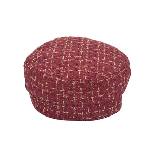 Detail of tweed newsboy cap with burgundy wool fabric and gold metallic thread accents