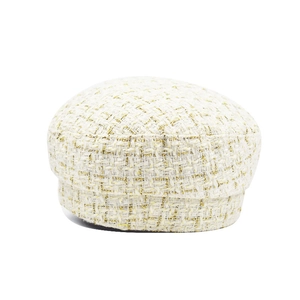 Detail of cream tweed beret with gold metallic threads and elegant woven texture
