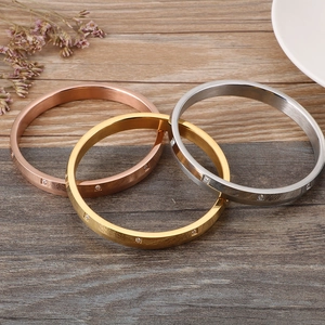 Three-piece stainless steel bangle set with zircon inlay in gold, rose gold, and silver