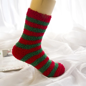Warm coral fleece Christmas socks featuring festive red and green horizontal stripes