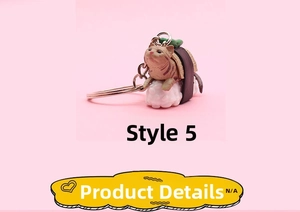Detail of cute brown tabby cat sushi plush keychain with silver lobster clasp on pink background