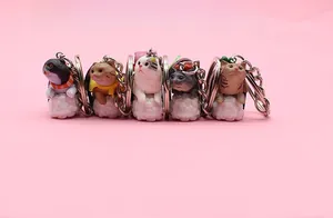 Set of five cute sushi cat keychains on cloud bases arranged in a row over pink background