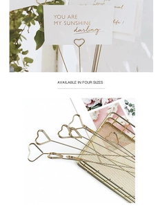 Detail of gold heart-shaped metal card holders available in four different sizes