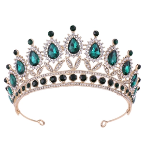 Baroque gold bridal crown featuring emerald green crystals and white rhinestones