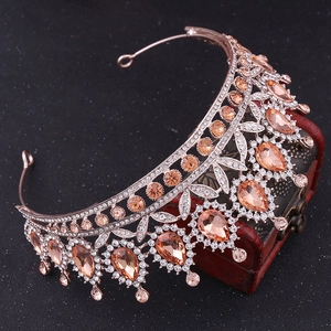 Close-up of baroque bridal tiara with pear-cut champagne crystals and micro-pave zircons