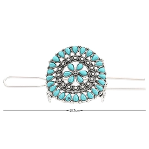 Detail view of vintage bohemian flower hair stick with turquoise inlay and 10.7cm length
