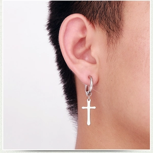 Unisex stainless steel hoop earring with cross pendant and tassel chain on model