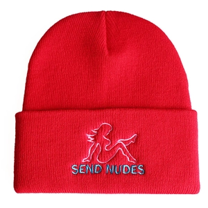 Red knit beanie with Send Nudes embroidery and a folded cuff on a white background