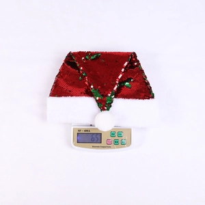 Close-up showing the precise weight of the red sequined Christmas hat at 65 grams