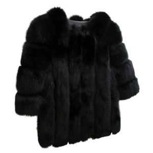 Detail of premium black faux fur coat with thick fluffy texture and short-cut design