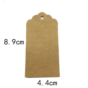 Blank brown kraft paper gift tag with dome top and dimensions 8.9cm x 4.4cm on white base