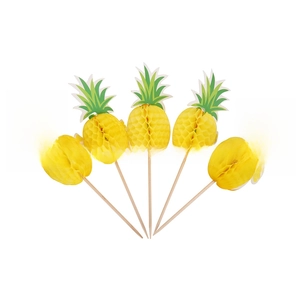 Detail of five yellow honeycomb pineapple cocktail picks with green paper leaves