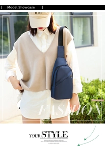 Outdoor shot of the navy blue nylon sling bag worn across chest with adjustable strap