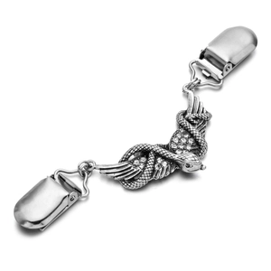Detail view of silver cardigan clip with snake wing design and clear rhinestones
