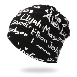 Streetwear black knit beanie with white graffiti style names and hip hop design