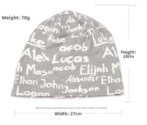 Detail view of light grey knit beanie with white script letters showing 26cm height size