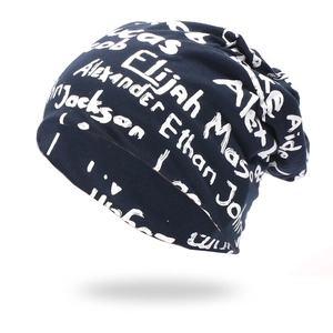 Navy blue knitted beanie with white graffiti alphabet print for casual street style
