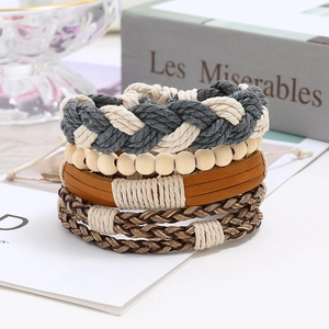 Detail shot of multi-layer retro braided leather bracelet set with wooden beads