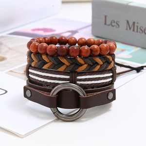 Detail shot of four-piece retro punk men leather bracelets with wood beads and metal charms