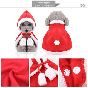 Detail view of red Christmas pet cape with plush white trim and soft velvet texture