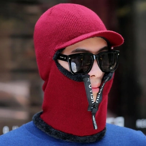 Detail of burgundy winter knit hat with fleece lining and adjustable zipper mask