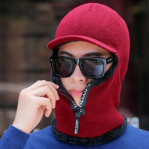 Detail of red knitted balaclava with zipper closure and thick black fleece lining
