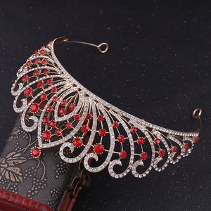 Detail of luxury Baroque crown with red crystals and rhinestones on a vintage box